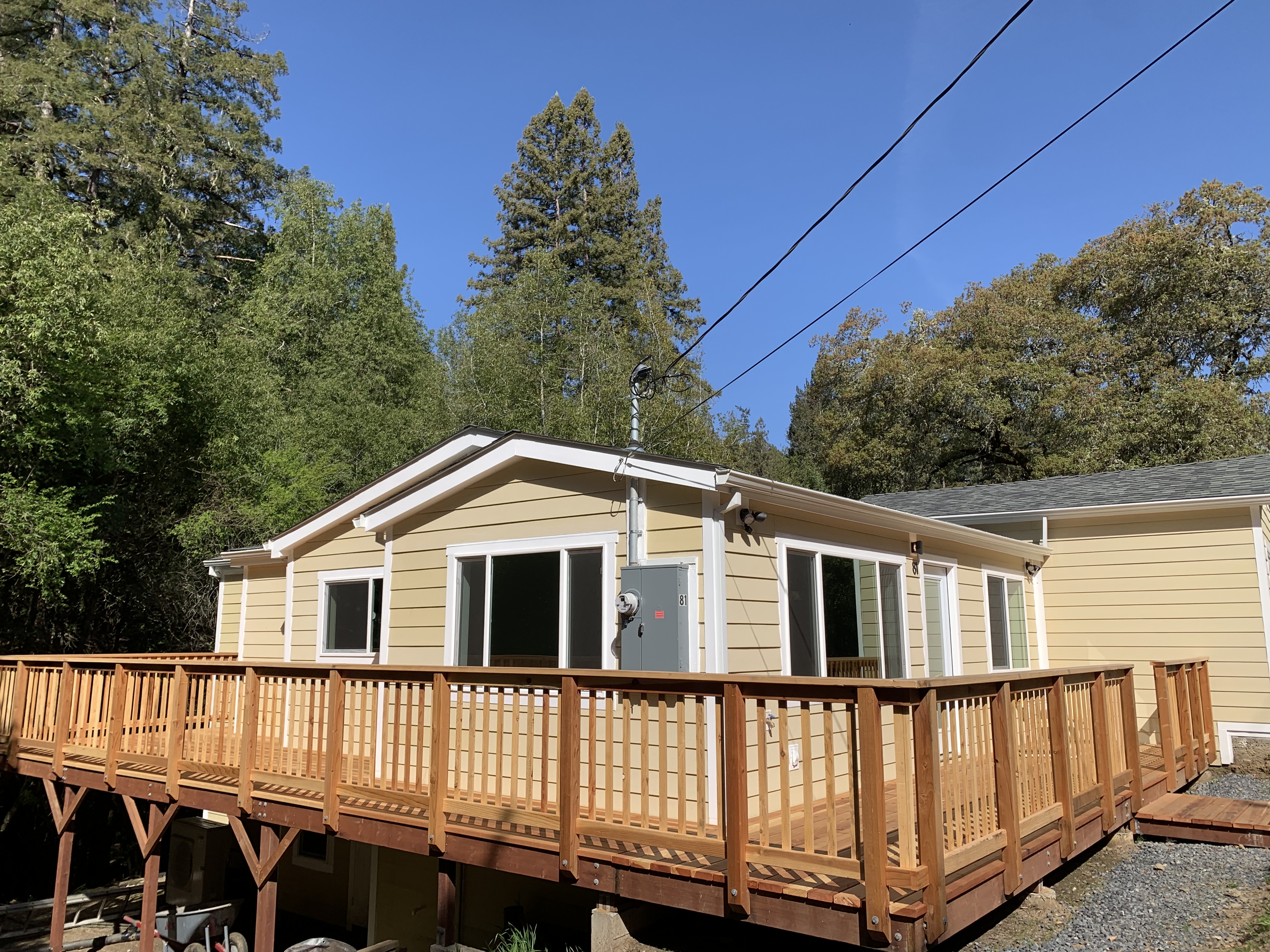 Finished front deck and exterior at Doug's House