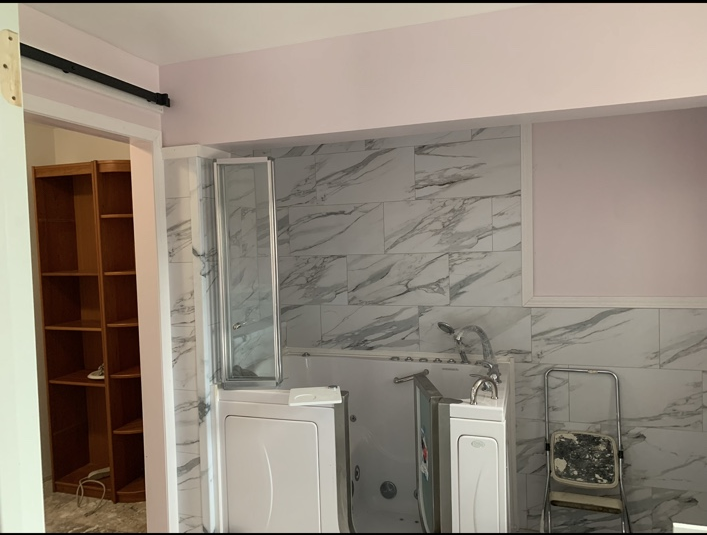 Finished bathroom conversion with walk-in tub
